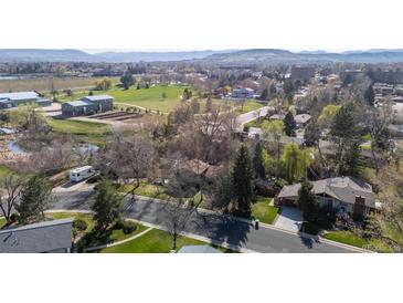 Overhead view showcases this home's peaceful neighborhood with mature trees, green lawns, and convenient street access at 2949 Vivian St, Wheat Ridge, CO 80215