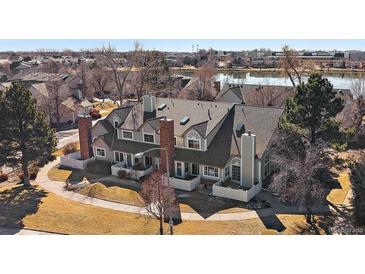 Charming townhome with a well-maintained front yard and picturesque lake view in a desirable community at 1080 E 130Th Ave # A, Thornton, CO 80241