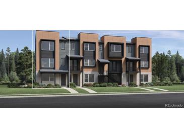 Modern townhome exterior with multi-tone facade, black trim, a covered entry, and professional landscaping at 2545 Josephine Way, Superior, CO 80027