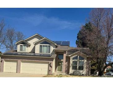 Charming two-story home with a two car garage, solar panels, and a well-maintained front yard at 3701 W 98Th Pl, Westminster, CO 80031
