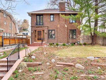 Charming brick home with a well-maintained front yard and inviting curb appeal at 1944 Hudson St, Denver, CO 80220