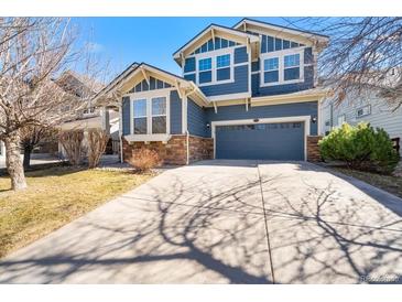 Charming two-story home with a two car garage and stone accents at 1027 Koss St, Erie, CO 80516