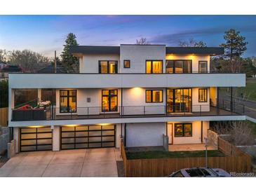 Striking three-story home with multiple balconies, modern design, and ample garage space at 2501 Vrain St, Denver, CO 80212