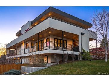 Modern home with clean lines, open balcony, and a well-maintained yard at 2501 Vrain St, Denver, CO 80212