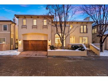 Charming two-story home featuring an attached garage and well-manicured landscaping at 100 S University Blvd # 11, Denver, CO 80209