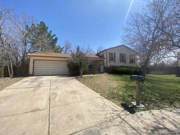 Ranch-style home with attached garage and spacious yard at 18249 E Mexico Pl, Aurora, CO 80017