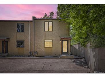 Inviting home exterior featuring a private courtyard and neutral-colored stucco facade at 800 Illinois St # 1, Golden, CO 80401