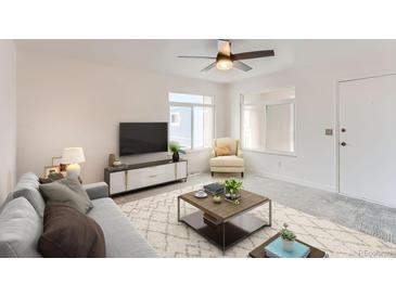 Inviting living room showcasing stylish furniture, a neutral color scheme, and natural light at 7902 Chase Cir # 152, Arvada, CO 80003