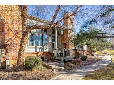 Brick townhouse exterior with private entrance and walkway at 4251 S Fairplay Cir # E, Aurora, CO 80014