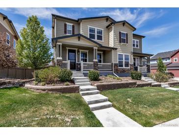 Charming two-story home features a welcoming front porch, stone accents, and well-manicured landscaping at 3429 Hardin St, Castle Rock, CO 80109