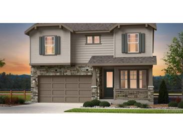 Beautiful two-story home featuring stone accents, a two-car garage, and well-manicured landscaping at 3353 N Catawba Way, Aurora, CO 80019