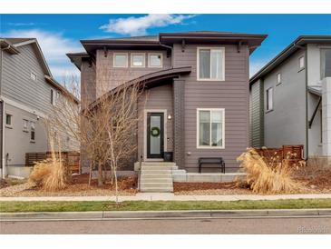 Charming two-story home featuring a modern design with beautiful curb appeal and inviting entryway at 6619 Mariposa Ct, Denver, CO 80221