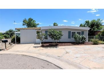 Charming single-story home featuring well-maintained landscaping and a concrete driveway at 2032 Tulane St, Denver, CO 80260