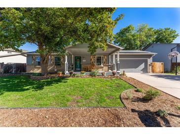 Charming ranch-style home with a well-maintained front yard, inviting porch, and appealing curb appeal at 10640 Nw Routt Way, Westminster, CO 80021