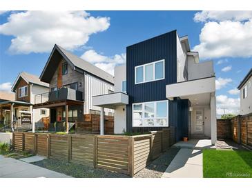 Modern two-story home featuring a sleek exterior and a well-maintained front yard with a wooden fence at 3632 Lipan St, Denver, CO 80211