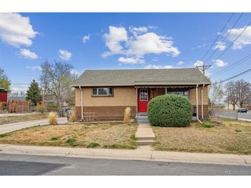 Charming single-story brick home with a well-maintained front yard and inviting curb appeal at 7624 Navajo St, Denver, CO 80221