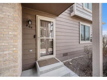 Inviting entryway with a charming screen door and visible house number at 804 Summer Dr, Highlands Ranch, CO 80126