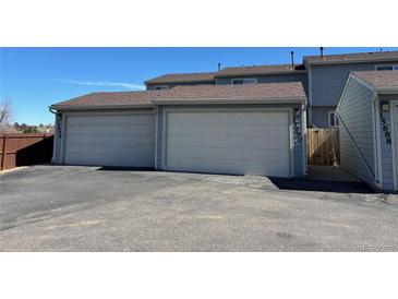 Attached garages offer convenience and ample parking space for residents of this multi-unit property at 15690 E Mexico Ave, Aurora, CO 80017