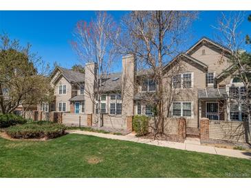 Charming townhomes feature lush front lawn, private patios, and beautiful architectural details at 1673 S Fulton St, Aurora, CO 80247