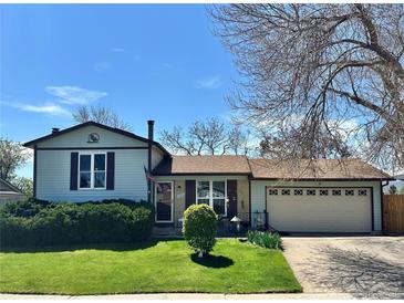 Charming single-Gathering home with a well-manicured lawn and attached two car garage at 12622 W Radcliff Ave, Morrison, CO 80465