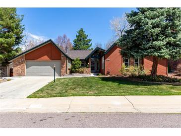 Charming single-Gathering home with a well-manicured lawn and mature landscaping at 7778 S Cherry Ct, Centennial, CO 80122