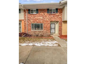 Charming brick townhome featuring a well-maintained exterior and inviting entrance at 3957 S Boston St, Denver, CO 80237