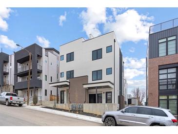Modern two-story home featuring clean lines, neutral colors, and stylish architectural details at 1252 Yates St, Denver, CO 80204