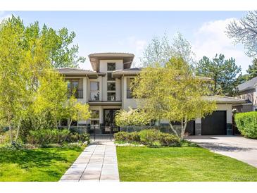 Beautiful two-story home with manicured lawn, mature trees, and inviting front entrance at 19 S Eudora St, Denver, CO 80246