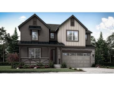 Charming two-story home featuring a stone facade, a covered front porch and a two car garage at 7444 S Yank Ct, Littleton, CO 80127