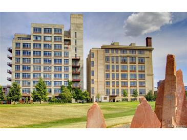 This is an image showing two apartment buildings from a ground-level outdoor view with landscaping in the foreground at 2000 Little Raven St # 1B, Denver, CO 80202