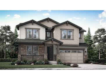 Charming two-story home featuring a stone-accented facade and a spacious two-car garage at 7436 S Yank Ct, Littleton, CO 80127