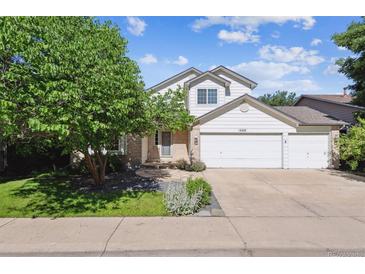 Charming two-story home featuring a three car garage and well-maintained landscaping at 13457 Glen Cir, Broomfield, CO 80020