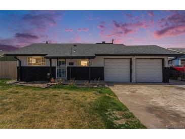 Charming single-story home with a well-manicured lawn and an attached two-car garage at 8191 Tennyson St, Westminster, CO 80031