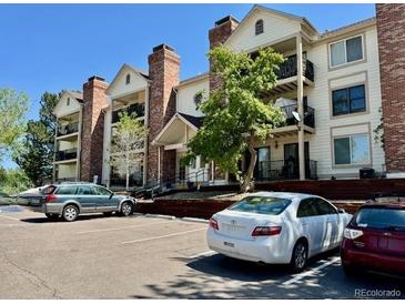 Lovely condo building featuring brick accents and private balconies perfect for enjoying the Colorado sunshine at 15911 E Dakota Pl # 301, Aurora, CO 80017