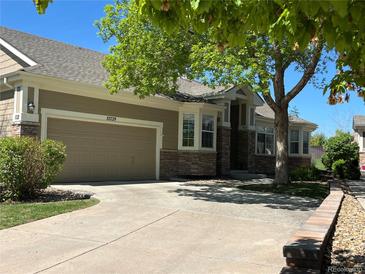 Charming single-Gathering home with a well-maintained lawn and a two-car garage at 13739 Legend Trl # 102, Broomfield, CO 80023