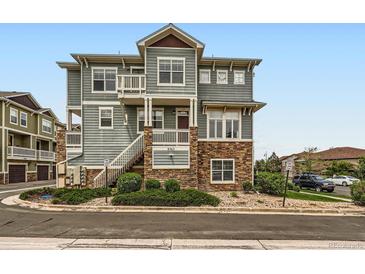 Beautiful multi-level condo with stone accents and a private balcony, blending style and outdoor living at 9363 Amison Cir # 106, Parker, CO 80134