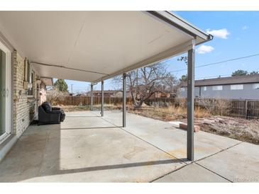 This home features a spacious covered patio great for entertaining and relaxing outdoors at 2572 Beech Ct, Golden, CO 80401
