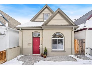 Charming craftsman home with red door and brick walkway at 1342 Lipan St, Denver, CO 80204