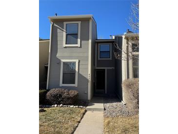Charming townhome with a well-maintained front yard and neutral-toned siding, offering a welcoming curb appeal at 4663 S Fraser Ct # C, Aurora, CO 80015