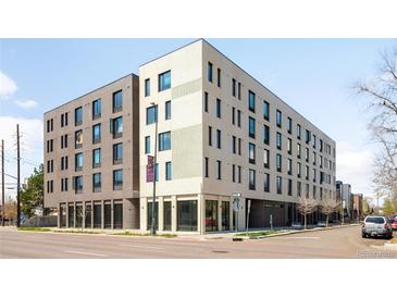 Modern building featuring gray and cream colored brick and large windows, enhanced by a clean, urban landscape at 603 Inca St # 432, Denver, CO 80204