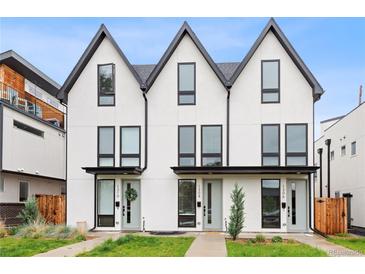 Modern townhouse exterior showcasing a clean, white facade with black trim and inviting front entrances at 1308 Stuart St, Denver, CO 80204