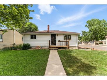 Charming home with a well-maintained lawn and welcoming front porch at 4505 W Gill Pl, Denver, CO 80219