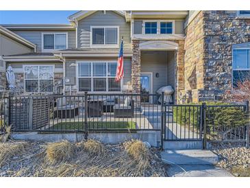 Charming townhome with a fenced front patio perfect for relaxing outdoors at 1897 S Buchanan Cir, Aurora, CO 80018