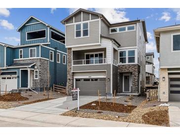 Attractive new construction home with a two-car garage and professional landscaping at 8480 Eagle River St, Littleton, CO 80125