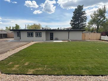 Stunning single-story home with well-manicured lawn and inviting entrance at 9950 W 17Th Ave, Lakewood, CO 80215