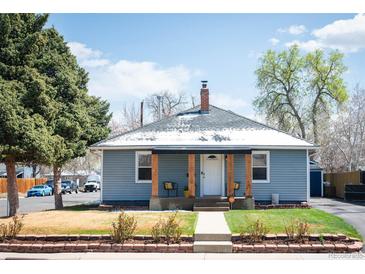 Charming single-story home featuring a covered front porch and well-maintained landscaping at 1794 Xenia St, Denver, CO 80220