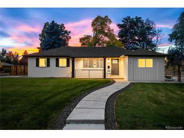 Charming single-story home with a well-maintained lawn and a welcoming walkway leading to the front door at 2999 S Adams St, Denver, CO 80210