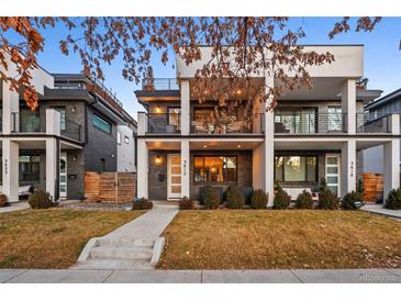 Modern home with a covered front porch and second-story balcony, plus manicured front yard at 3612 Vallejo St, Denver, CO 80211