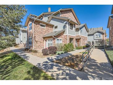Charming multi-story home features stone accents, manicured landscaping, and inviting walkways at 2541 S Bahama Cir # F, Aurora, CO 80013