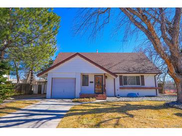 Charming home featuring a well-kept lawn, and a single-car garage at 3000 S Newland St, Denver, CO 80227